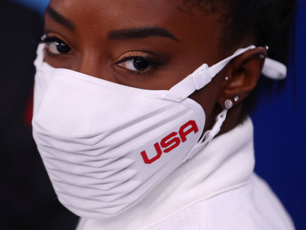 Silver medallist Simone Biles of the United States wearing a protective face mask looks on at the Ariake Gymnastics Centre, Tokyo July 27, 2021. u00e2u20acu201d Reuters picnn