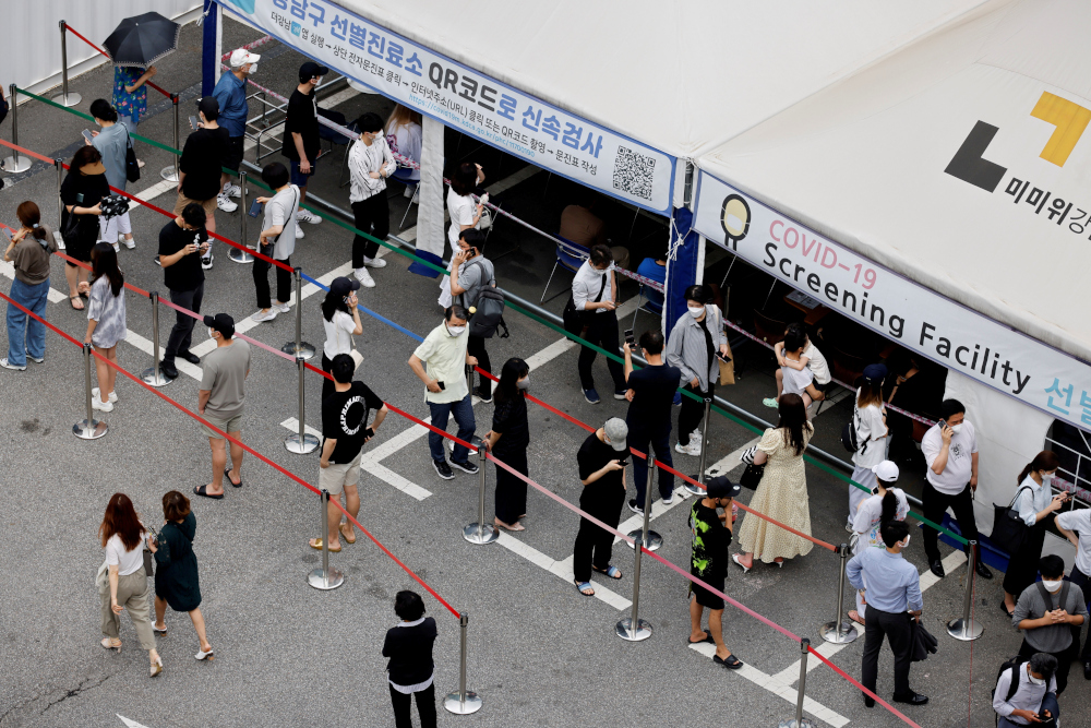 People wait in line for a Covid-19 test at a testing site which is temporarily set up at a public health centre in Seoul, South Korea, July 9, 2021. u00e2u20acu201d Reuters picnn