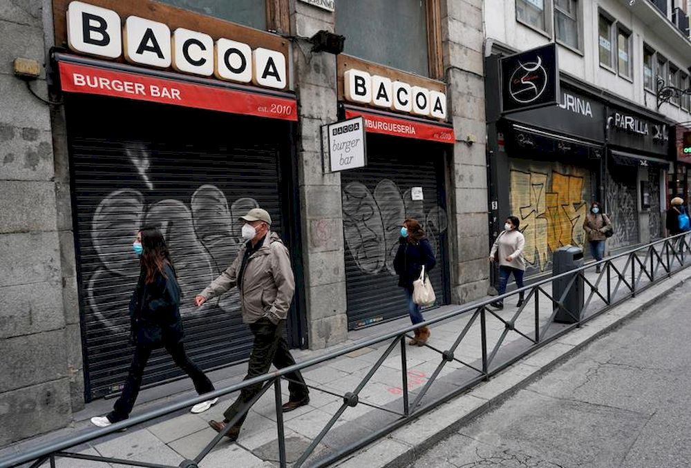 People walk near closed shops amid the coronavirus disease (Covid-19) outbreak in Madrid, Spain, November 4, 2020. u00e2u20acu201d Reuters pic