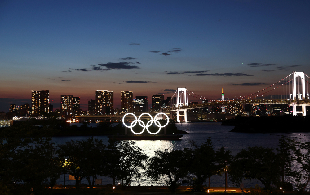 The Olympic Rings are seen in front of the skyline during sunset one night ahead of the official opening of the Tokyo 2020 Olympic Games in Tokyo, Japan, July 22, 2021. u00e2u20acu201d Reuters picnn