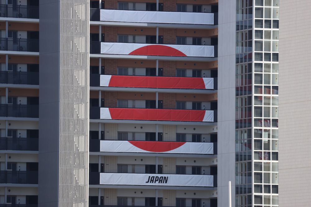 Signs from the Japan Olympic team hang on the apartment building hosting Olympics participants at the Athletes Village, where two athletes have tested positive for Covid-19 in Tokyo July 18, 2021. u00e2u20acu201d Reuters pic