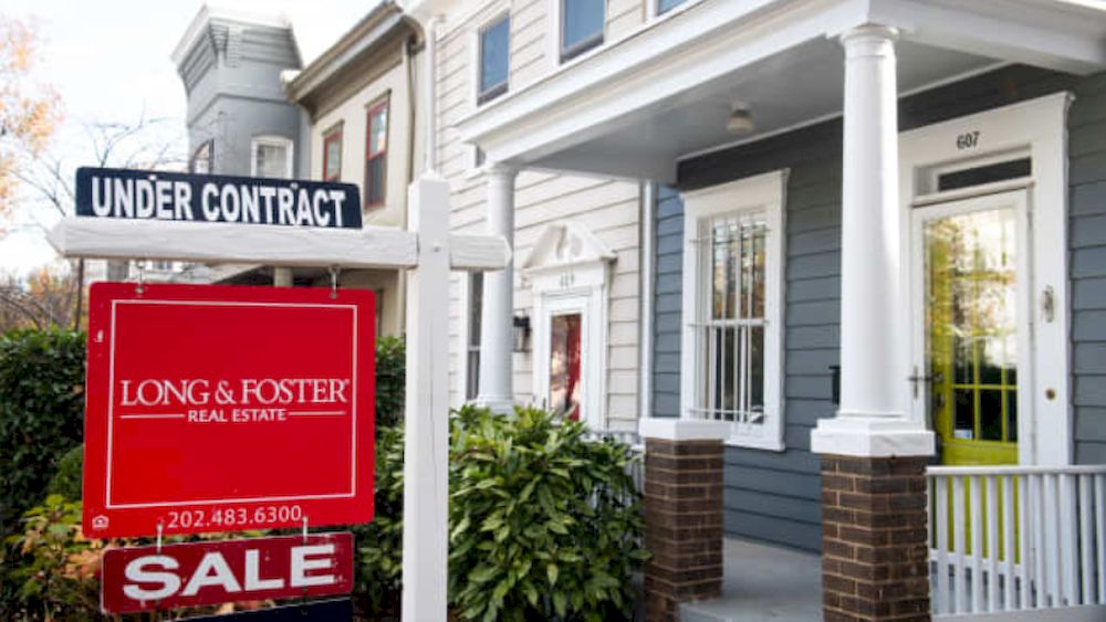 A house real estate for sale sign shows the home as being u00e2u20acu02dcunder contractu00e2u20acu2122 in Washington, DC, November 19, 2020. u00e2u20acu201d AFP file pic