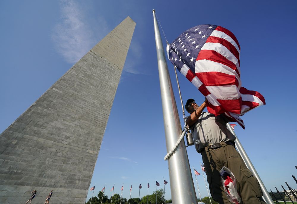 A National Park Service worker replaces a flag at the Washington Monument which reopened today following a six month closure due to Covid-19 safety measures, in Washington July 14, 2021. u00e2u20acu201d Reuters pic