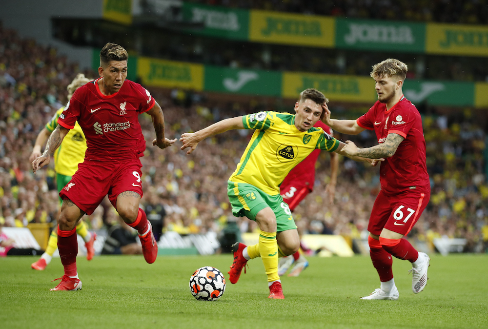 Norwich City's Billy Gilmour in action with Liverpool's Roberto Firmino and Harvey Elliott, August 14, 2021. u00e2u20acu201d Action Images via Reuters/Peter Cziborra 