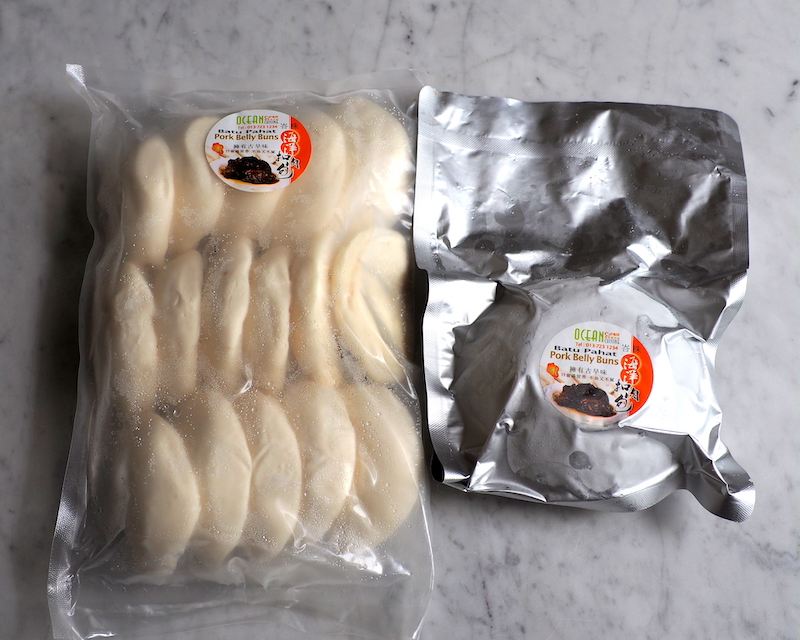 The set has the frozen pork belly in a vacuum packed bag and 16 lotus buns in a separate packet 