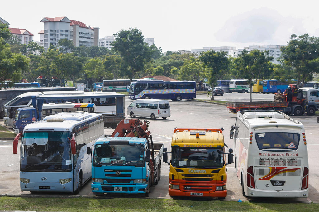 A tripartite workgroup is proposing that under the Progressive Wage Model, general drivers would getu00c2u00a0at least S$1,750 gross salary a month and specialised drivers would get at least S$1,850. u00e2u20acu201d TODAY pic