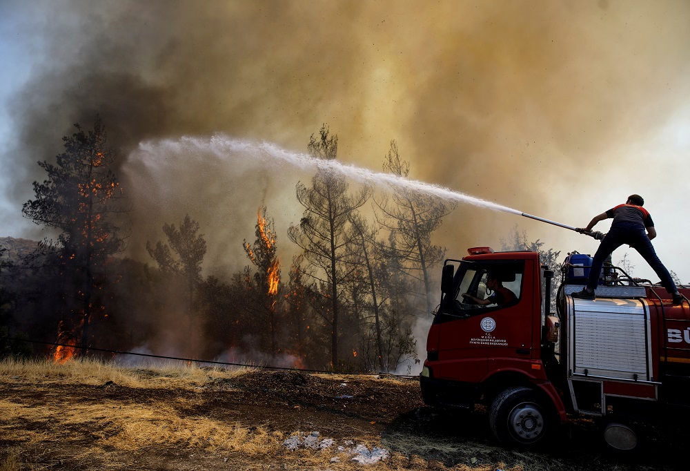 A firefighter tries to extinguish a wildfire near Marmaris, Turkey August 1, 2021. u00e2u20acu201d  REUTERS pic