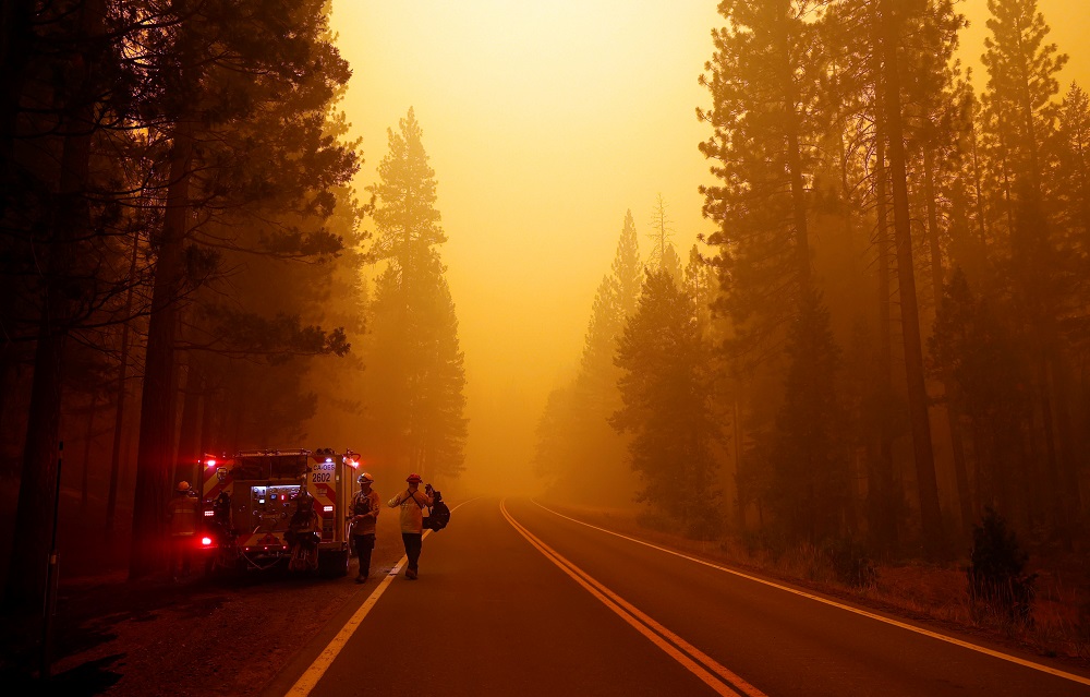 Firefighters put on fire gear before dousing hotspots at the Dixie Fire, a wildfire near the town of Greenville, California August 6, 2021. u00e2u20acu201d Reuters pic