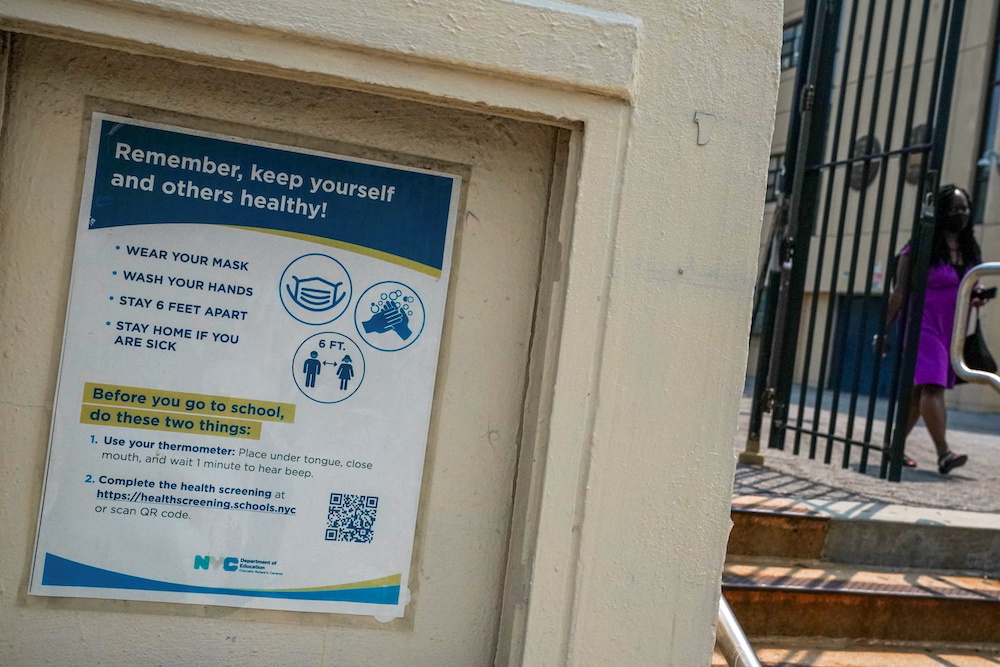 A sign at a Herbert H. Lehman High School encourages people to keep themselves and others safe from the coronavirus disease (Covid-19) by following safety precautions in the Bronx borough of New York City July 27, 2021. u00e2u20acu201d Reuters pic