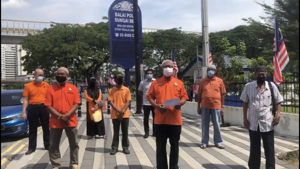 Bandar Tun Razak Amanah branch chief Hayatul kamil Termudi (centre) speaks to reporters after lodging a police report at the Sungai Besi police station August 14, 2021. u00e2u20acu201d Picture courtesy of Hayatul Kamil Termudi