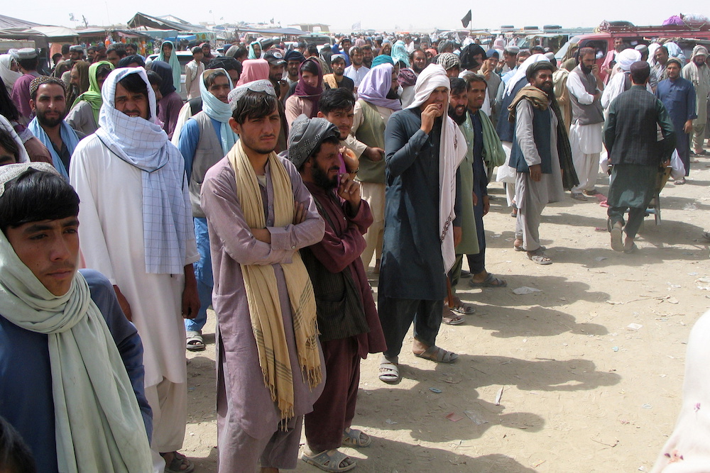People wait to cross at the Friendship Gate crossing point at the Pakistan-Afghanistan border town of Chaman, Pakistan August 15, 2021. u00e2u20acu201d Reuters picn n