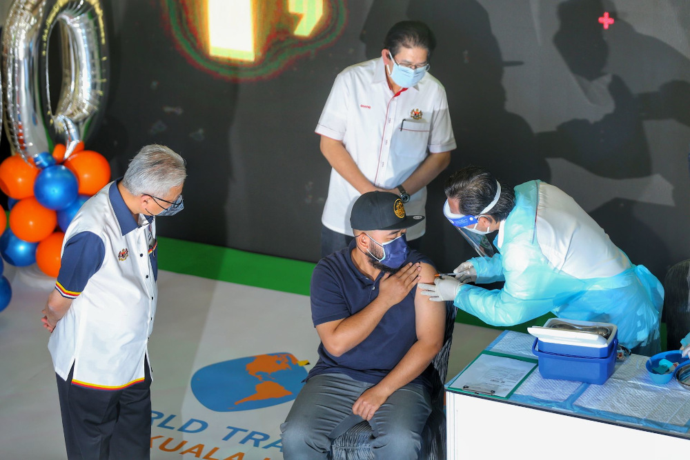 Prime Minister Datuk Seri Ismail Sabri Yaakob observes as a health worker administers the 1 millionth second dose of AstraZaneca Covid-19 vaccine at WTC Mega Vaccine Centre in Kuala Lumpur August 29, 2021. u00e2u20acu201d Picture by Ahmad Zamzahuri 