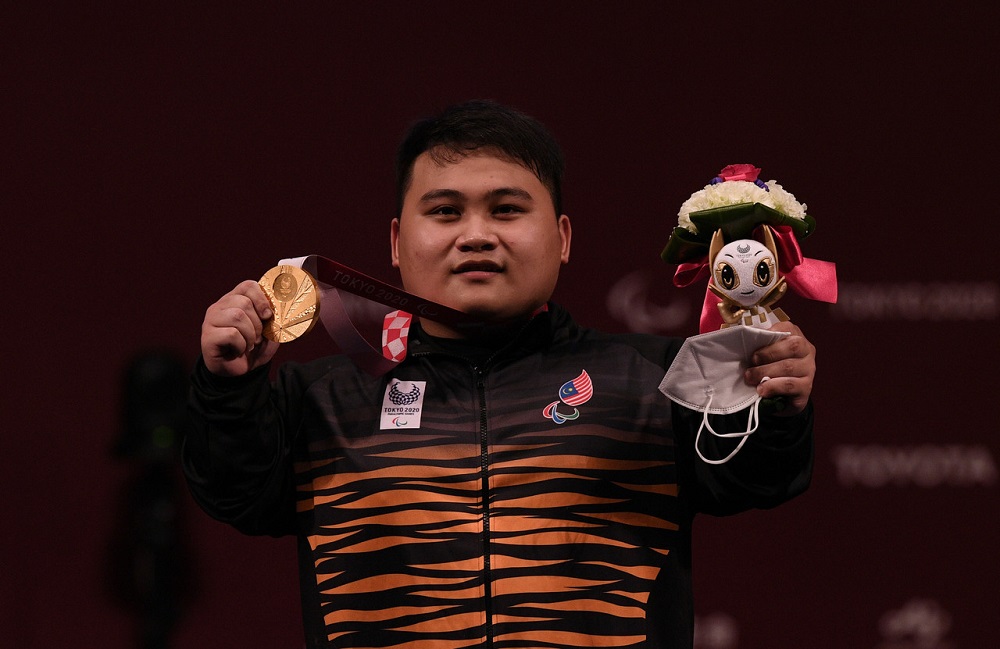 National paralympic powerlifter athlete Bonnie Bunyau Gustin wins the first gold medal for the 72kg category during the Tokyo 2020 Paralympic Games at the Tokyo International Forum August 28, 2021. u00e2u20acu201d Bernama pic
