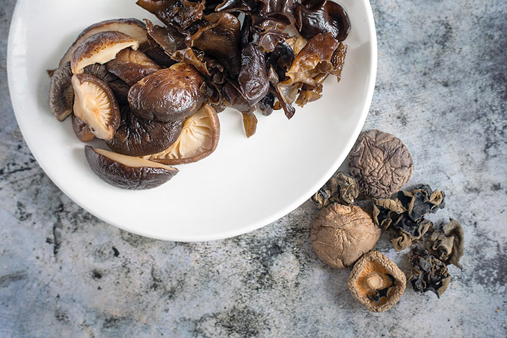 Rehydrate dried shiitake mushrooms and black/wood-ear fungus before cooking.