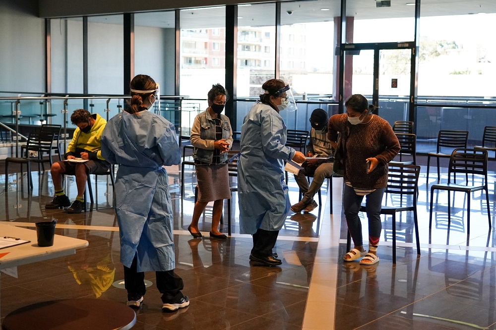 Medical staff assist members of the public in the waiting area of a Covid-19 vaccination clinic at the Bankstown Sports Club as the city experiences an extended lockdown, in Sydney, Australia August 3, 2021. u00e2u20acu2022 Reuters pic
