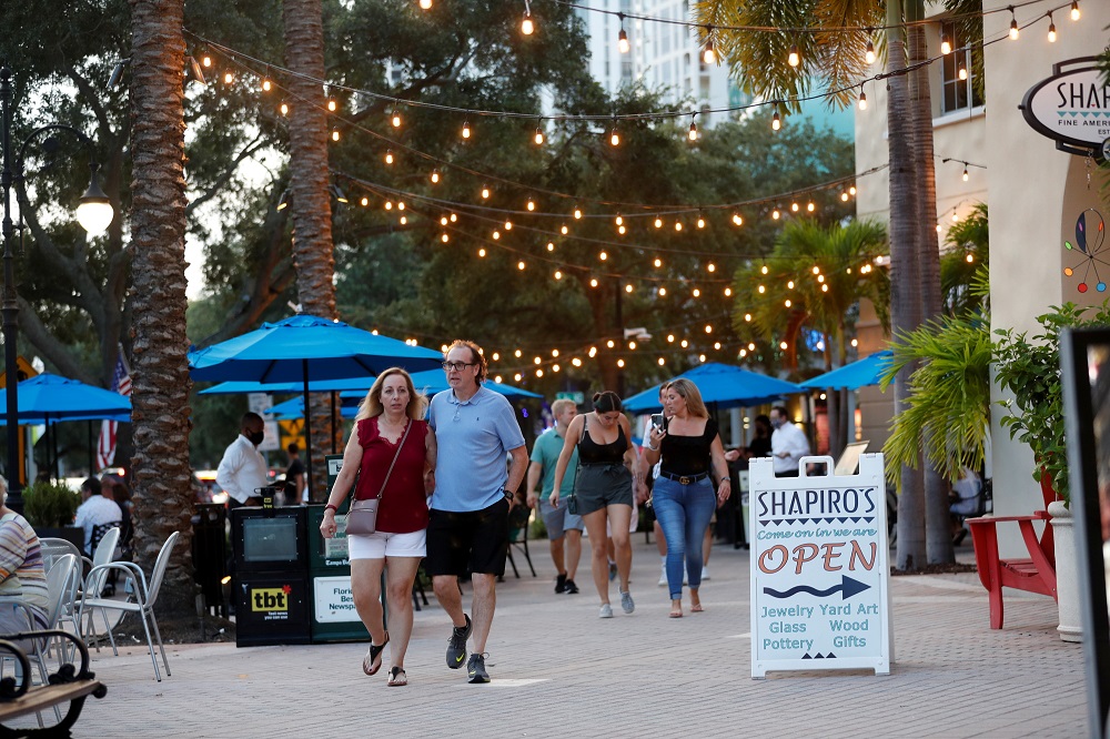 People walk on Beach Drive in downtown St. Petersburg, amid Covid-19 pandemic, in Florida, US August 6, 2021. Picture taken August 6, 2021. u00e2u20acu2022 Reuters pic