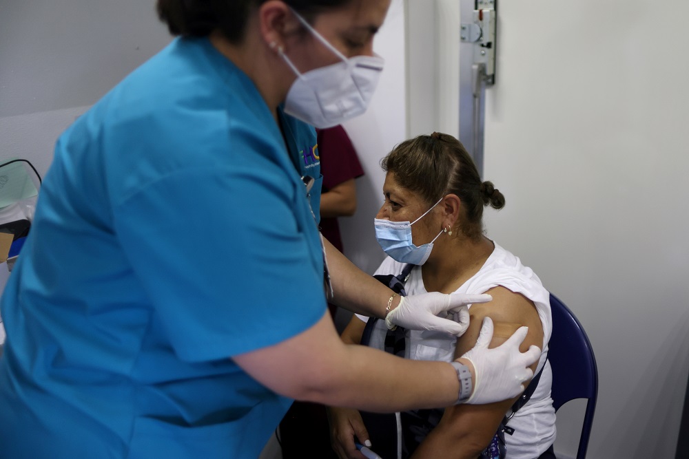 A woman receives her second Covid-19 vaccine at a back-to-school clinic in South Gate, Los Angeles, California August 12, 2021. u00e2u20acu2022 Reuters pic