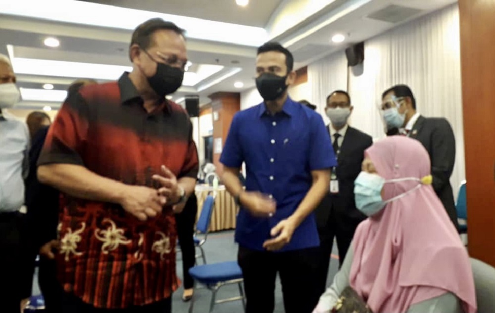Johor Mentri Besar Datuk Hasni Mohammad (left) at the Vaccination Centre (PPV) at KPJ Abdul Samad Hospital in Johor Baru August 6, 2021 u00e2u20acu201d Picture by Ben Tan