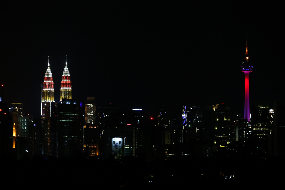 Malaysiau00e2u20acu2122s iconic buildings KLCC and KL Tower light up with the colours of the Malaysian flag in conjunction with the countryu00e2u20acu2122s 64th National Day celebration, August 30, 2021. u00e2u20acu201d Picture by Ahmad Zamzahuri