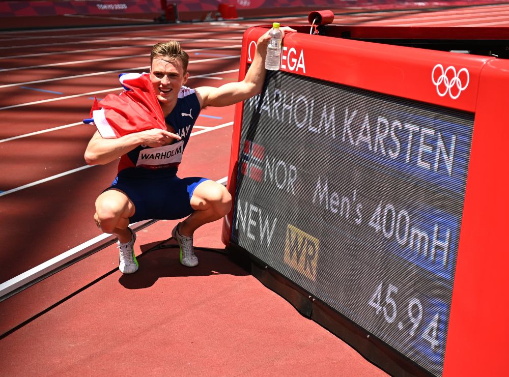 Karsten Warholm of Norway poses next to his new world record as he celebrates after winning gold during the men's 400m hurdles final at the Olympic Stadium, Tokyo August 3, 2021. u00e2u20acu2022 Reuters pic
