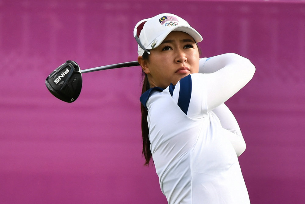 Malaysiau00e2u20acu2122s Kelly Tan watches her drive from the 1st tee in round 1 of the womenu00e2u20acu2122s golf individual stroke play during the Tokyo 2020 Olympic Games at the Kasumigaseki Country Club in Kawagoe August 4, 2021. u00e2u20acu2022 AFP pic 