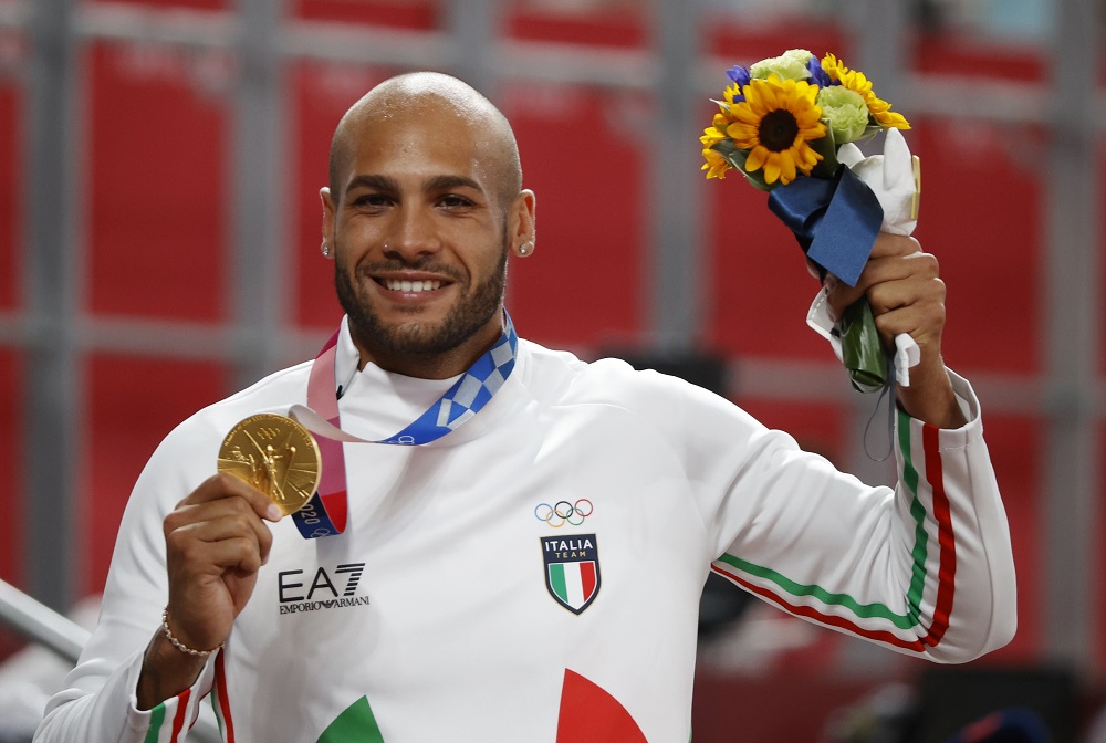 Gold medallist Lamont Marcell Jacobs of Italy celebrates with his medal after winning the Men's 100m event August 2, 2021. u00e2u20acu2022 Reuters pic