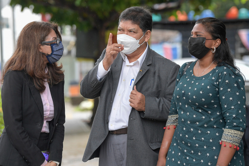 (From left) Lawyer Sangeet Kaur Deo, PKR chief whip Datuk Johari Abdul and Batu Kawan MP Kasthuri Patto at the Dang Wangi district police headquarters, August 5, 2021. u00e2u20acu2022 Bernama pic 