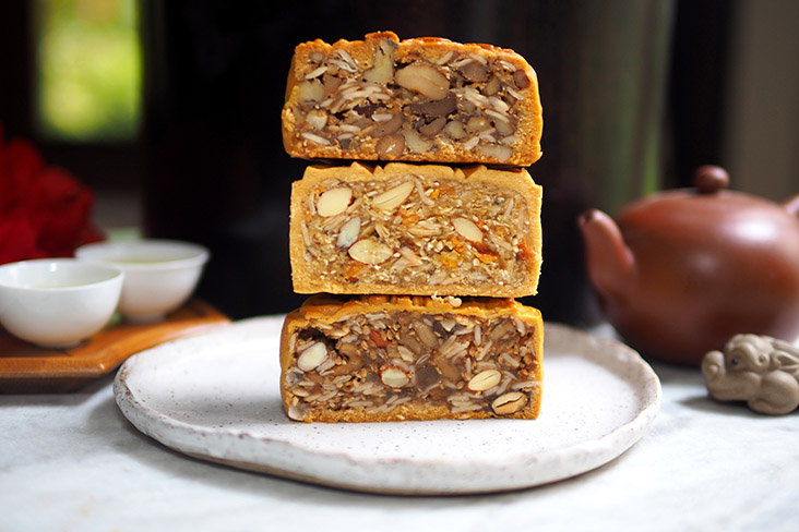 Stack them up and compare (from top to bottom) the CHG mixed nuts mooncake is packed with nuts and seeds, Shangri-La Kuala Lumpur's version is chockfull of preserved mandarin orange bits for that lovely fragrance and TK Bakery's assorted nuts without ham that has a lovely mix of nuts and seeds