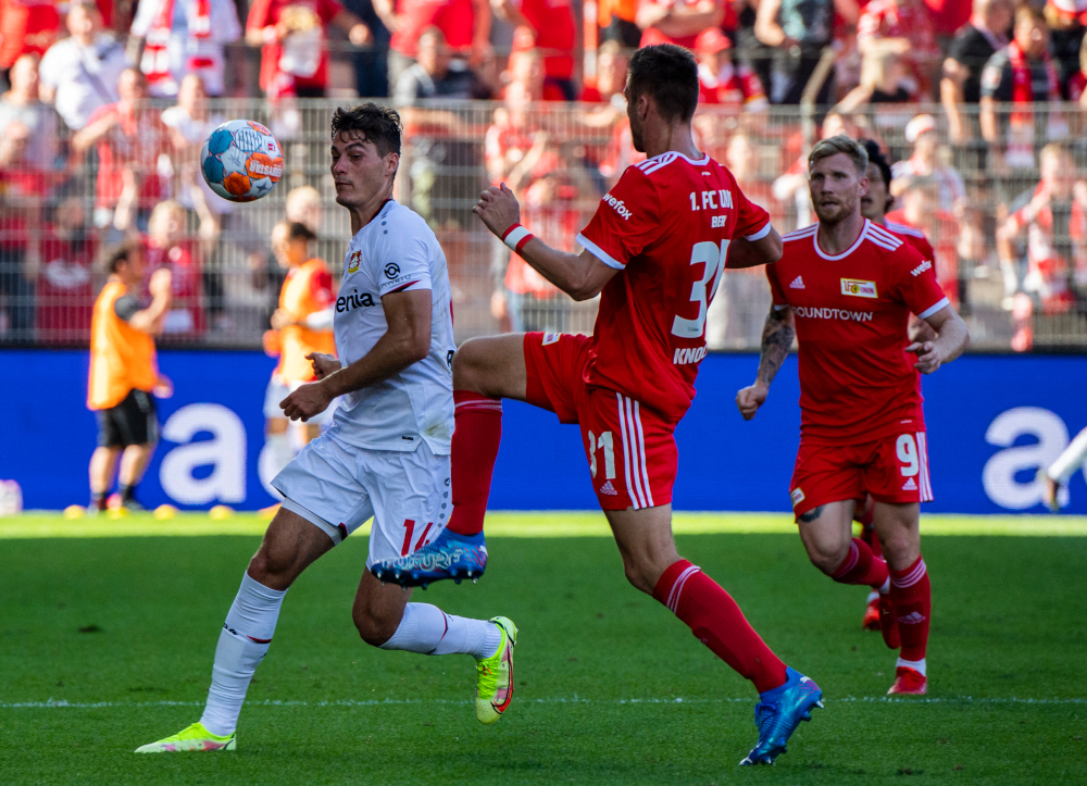 Leverkusenu00e2u20acu2122s Czech forward Patrik Schick (left) and Union Berlinu00e2u20acu2122s German defender Robin Knoche vie for the ball during the German first division Bundesliga football match in Berlin, August 14, 2021. u00e2u20acu201d AFP pic 