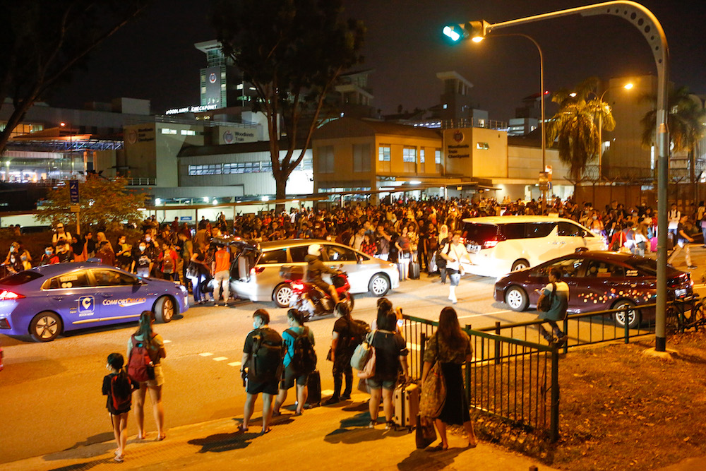 Droves of Malaysian working here rushed to enter Singapore on March 17 last year, via the Johor-Singapore Causeway. They braved long queues and traffic jams as they tried to make their way into Singapore before the lockdown took effect at midnight. — TO