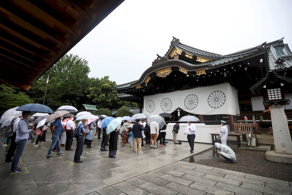 People practice social distancing while visiting Yasukuni Shrine on the 76th anniversary of Japan's surrender in World War Two, amid the coronavirus disease (Covid-19) pandemic, in Tokyo, Japan August 15, 2021. u00e2u20acu201d Reuters pic
