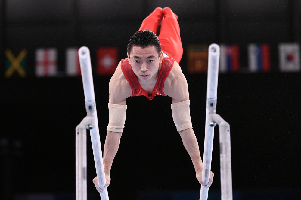 Chinau00e2u20acu2122s Jingyuan Zou competes in the artistic gymnastics menu00e2u20acu2122s parallel bars final of the Tokyo 2020 Olympic Games at Ariake Gymnastics Centre in Tokyo August 3, 2021. u00e2u20acu2022 AFP pic 