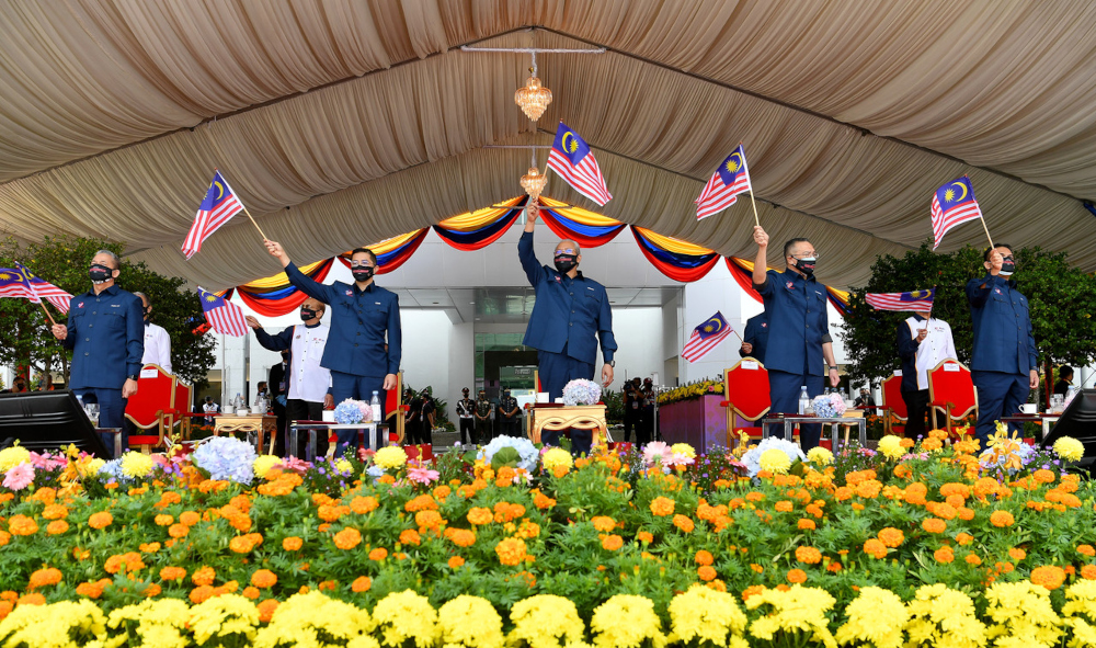 Communications and Multimedia Minister Tan Sri Annuar Musa waves the Jalur Gemilang at the 2021 National Day celebration held at Dataran Pahlawan Negara, August 31, 2021. u00e2u20acu201d Bernama pic 