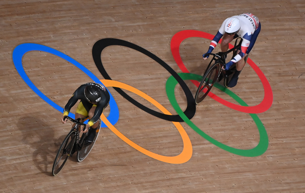 Britainu00e2u20acu2122s Jason Kenny (right) and Malaysiau00e2u20acu2122s Mohd Azizulhasni Awang compete in a heat of the menu00e2u20acu2122s track cycling sprint 1/32 finals during the Tokyo 2020 Olympic Games at Izu Velodrome in Izu, Japan, August 4, 2021. u00e2u20acu2022 AFP pic 