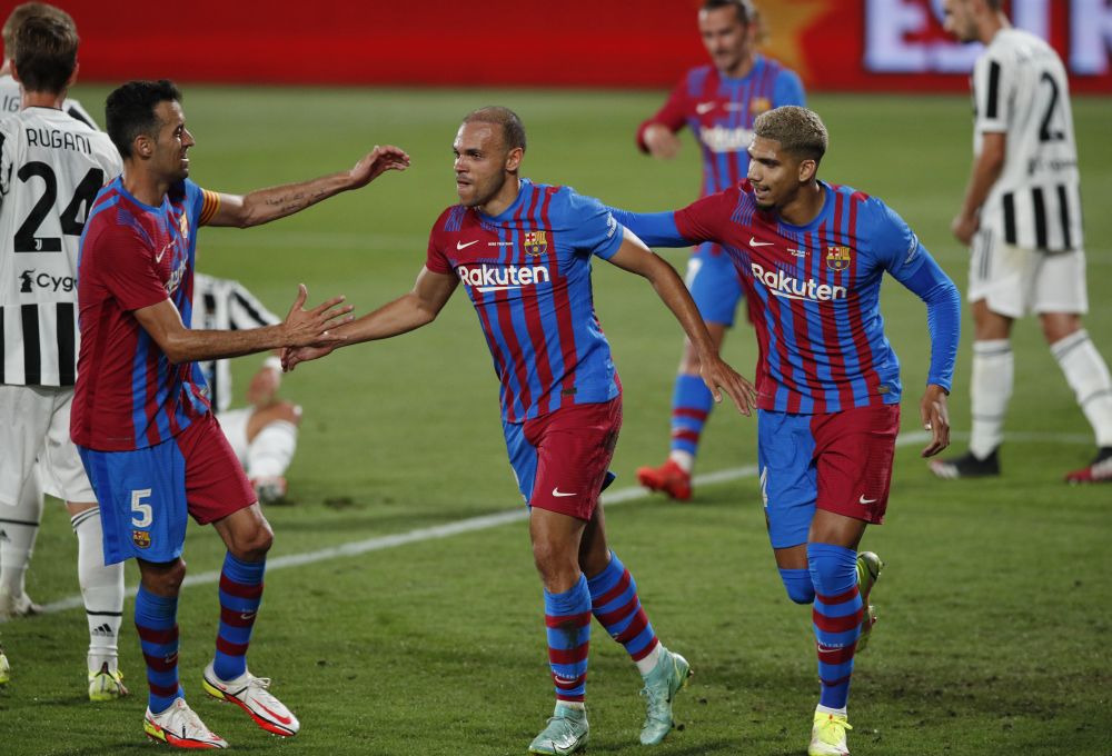 Barcelona's Martin Braithwaite celebrates scoring their second goal against Juventus with Sergio Busquets and Ronald Araujo at Estadi Johan Cryuff in Barcelona August 8, 2021. u00e2u20acu201d Reuters picn