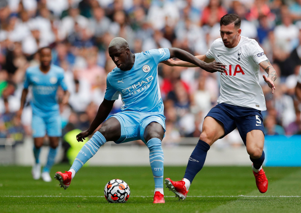 Manchester Cityu00e2u20acu2122s Benjamin Mendy in action with Tottenham Hotspuru00e2u20acu2122s Pierre-Emile Hojbjerg at Tottenham Hotspur Stadium, London, Britain, August 15, 2021. u00e2u20acu201d Reuters pic