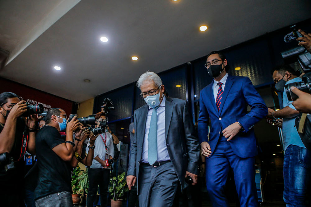 Bersatu secretary-general Datuk Seri Hamzah Zainudin (left) together with Armada chief Wan Ahmad Fayhsal Wan Ahmad Kamal leaving the Bersatu office in Petaling Jaya, August 16, 2021. u00e2u20acu201d Picture by Hari Anggara