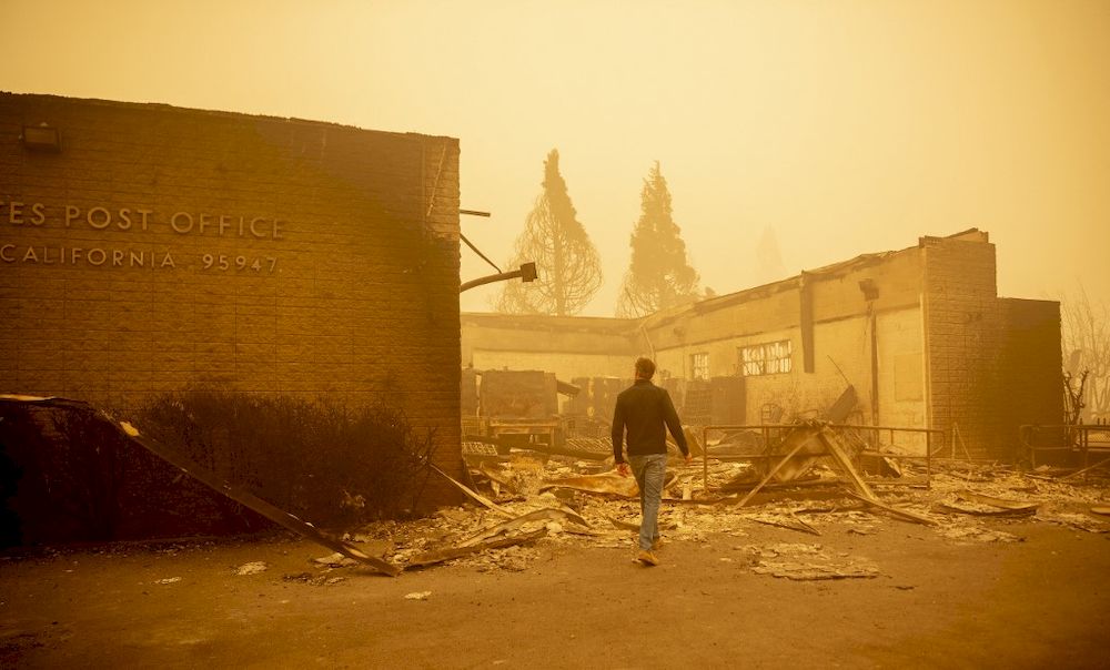 California Governor Gavin Newsom surveys a burned United States Post Office in downtown Greenville, California on August 7, 2021. u00e2u20acu201d AFP pic