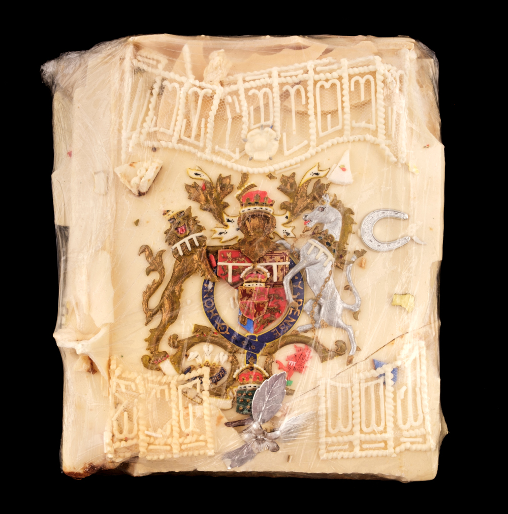 An undated handout picture released August 11, 2021 shows a slice of cake from the 1981 wedding of Prince Charles and Diana that is up for auction. u00e2u20acu2022 Dominic Winter Auctioneers handout pic via AFPnn