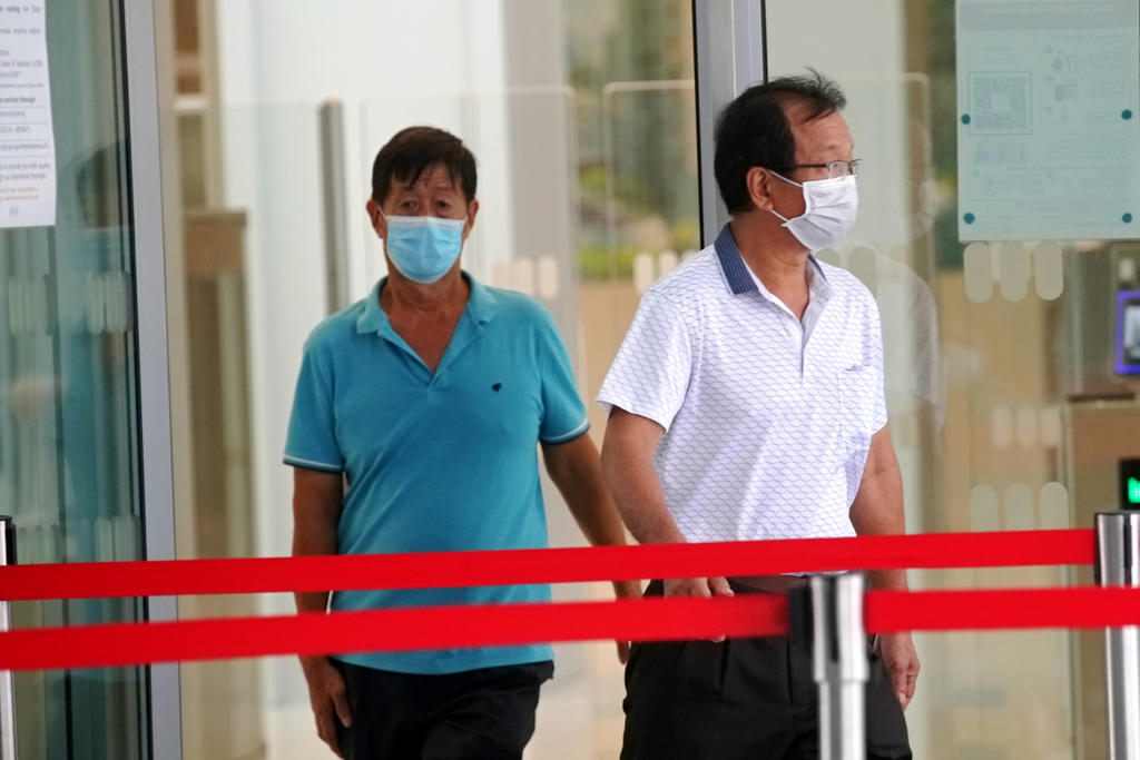 Ng Kiong Hoe (left) said he was asked by his friend Cheng Lee Meng (right) to accompany him to the restricted area in Lim Chu Kang. u00e2u20acu201d TODAY pic
