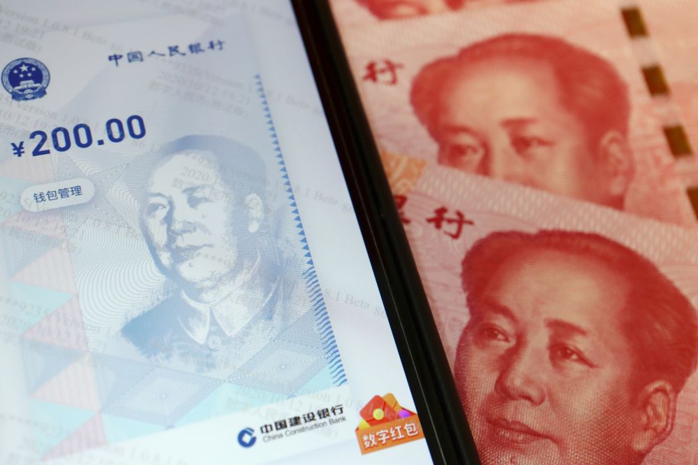 China's official app for digital yuan is seen on a mobile phone next to 100-yuan banknotes in this illustration picture taken October 16, 2020. u00e2u20acu201d Reuters picnn