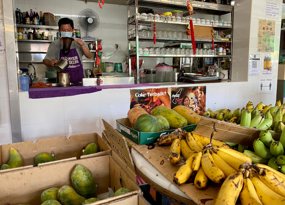 Island Park cafe owner Tan has taken to selling fruits and vegetables to supplement his income. ― Picture by Steven Ooi KE
