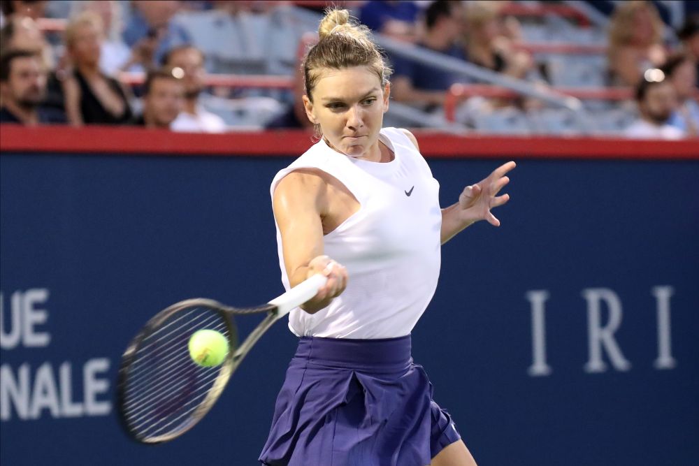 Simona Halep hits a shot against Danielle Collins during the second round play at Stade IGA, Montreal August 12, 2021. u00e2u20acu201d Reuters pic