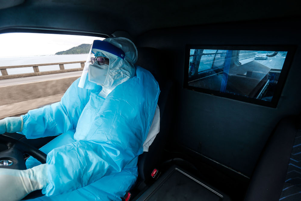 A state health driver transports the body of a Covid-19 victim to the burial site, at the Forensic Medical Department, Penang General Hospital, August 24, 2021. u00e2u20acu201d Picture by Sayuti Zainudin