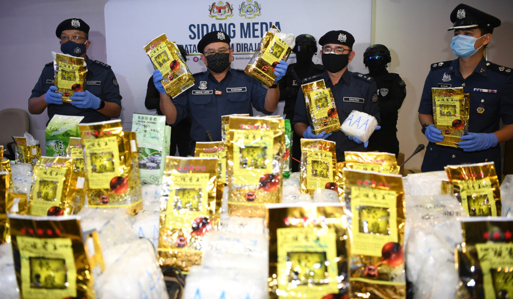Customs director-general Datuk Seri Abdul Latif Abdul Kadir with the seized drugs at the Customs (Narcotics) headquarters at Kg Jijan in Nilai, August 26, 2021. u00e2u20acu201d Bernama picnn