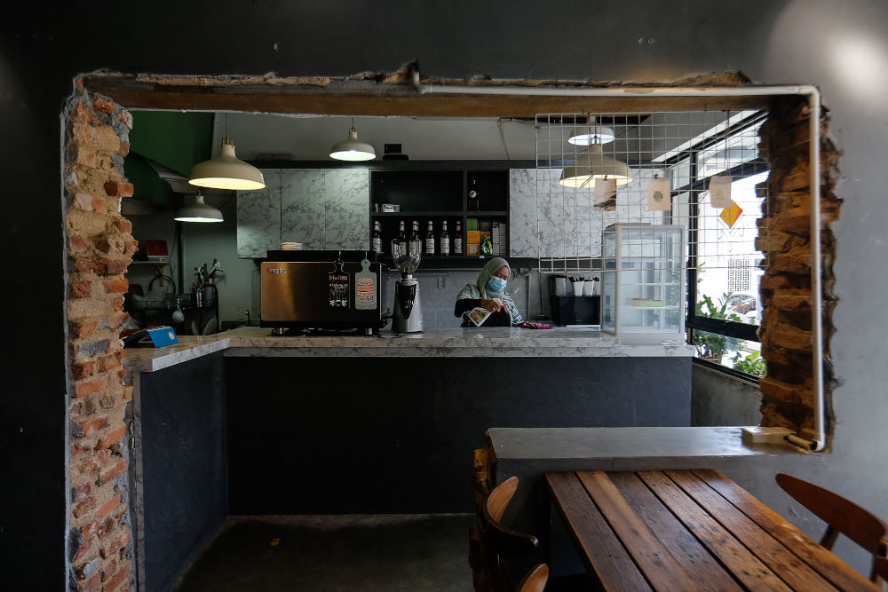 Staff of The Table preparing the restaurant to receive dine-in customers after the prime ministeru00e2u20acu2122s announcement yesterday on dining in for vaccinated individuals, at Lebuh Carnavon, August 9, 2021. u00e2u20acu201d Picture by Sayuti Zainudin