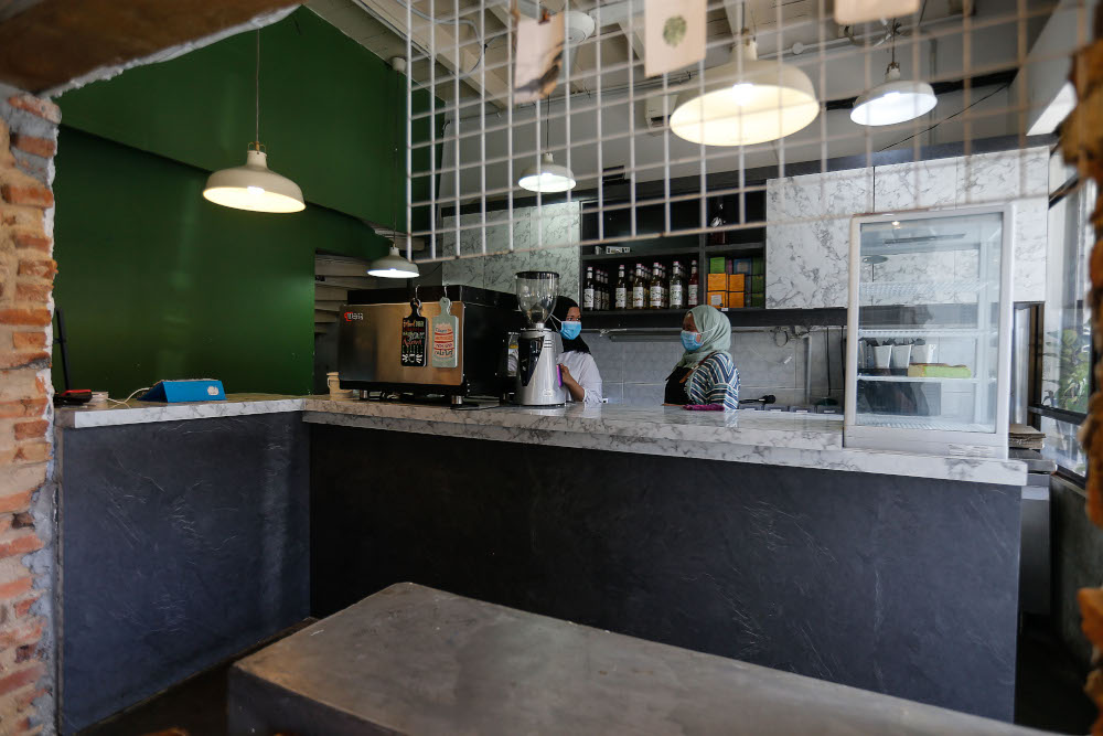 Staff of The Table preparing the restaurant to receive dine-in customers after the prime ministeru00e2u20acu2122s announcement yesterday on dining in for vaccinated individuals, at Lebuh Carnavon, August 9, 2021. u00e2u20acu201d Picture by Sayuti Zainudin