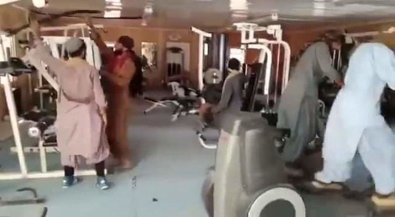 Taliban soldiers filmed each other while exploring gym equipment in Afghanistan. u00e2u20acu201d Screengrab from TRT World Facebook 