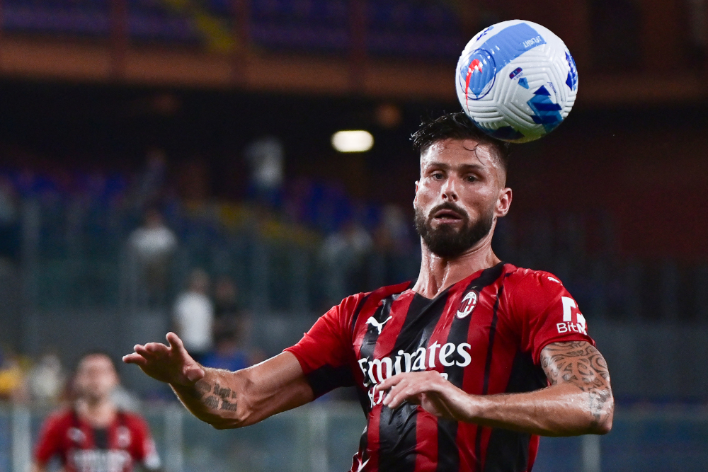 AC Milanu00e2u20acu2122s French forward Olivier Giroud heads the ball during the Italian Serie A football match between Sampdoria and AC Milan at the Luigi Ferraris stadium in Genova, August 23, 2021. u00e2u20acu201d AFP pic 