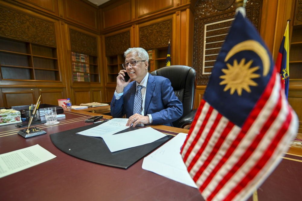 Prime Minister Datuk Seri Ismail Sabri Yaakob receives a phone call from Australian Prime Minister Scott John Morrison at Perdana Putra, August 24, 2021. — Bernama pic 